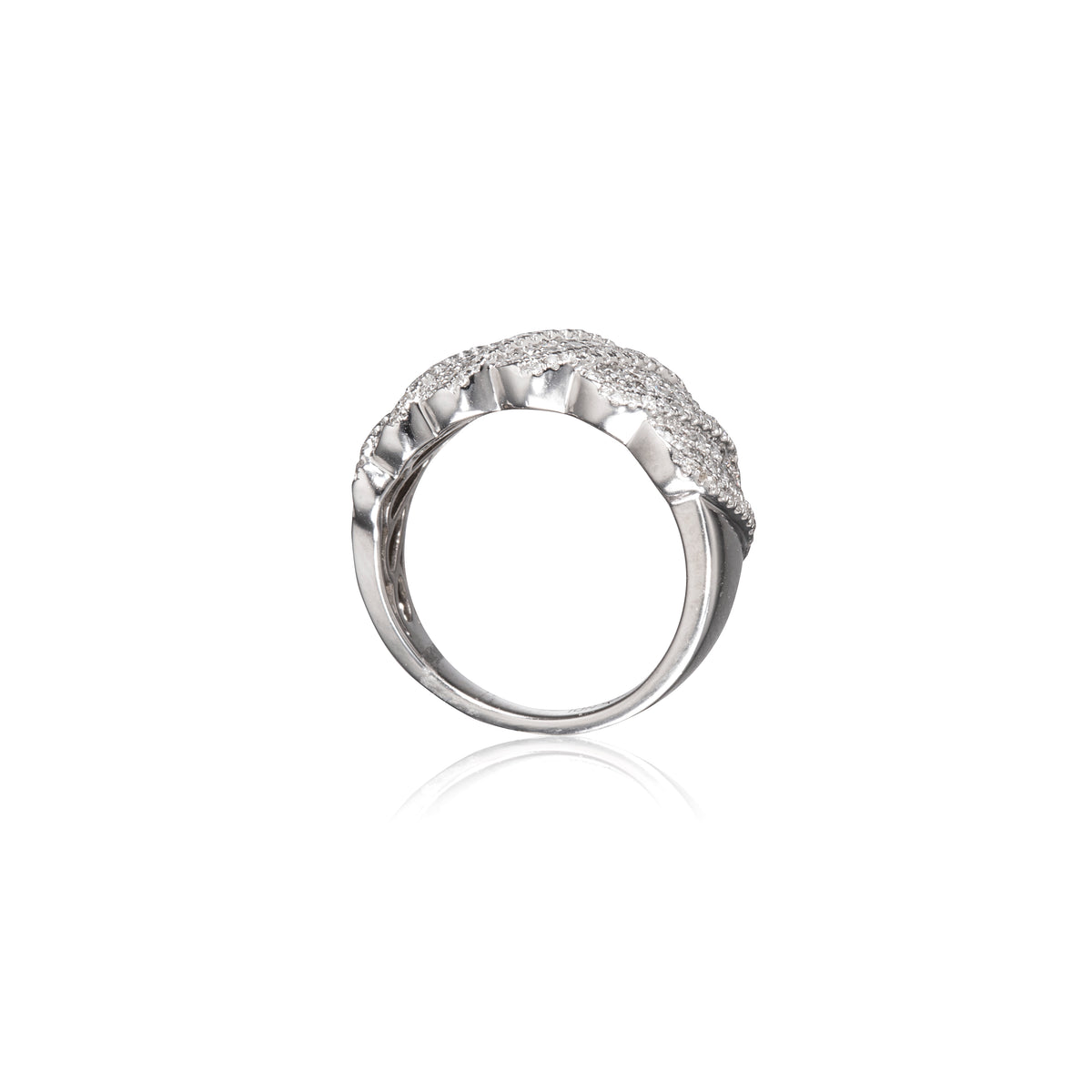 A white gold ring with a textured, scalloped top set with small clear stones, shown on a plain white background with a soft reflection below.