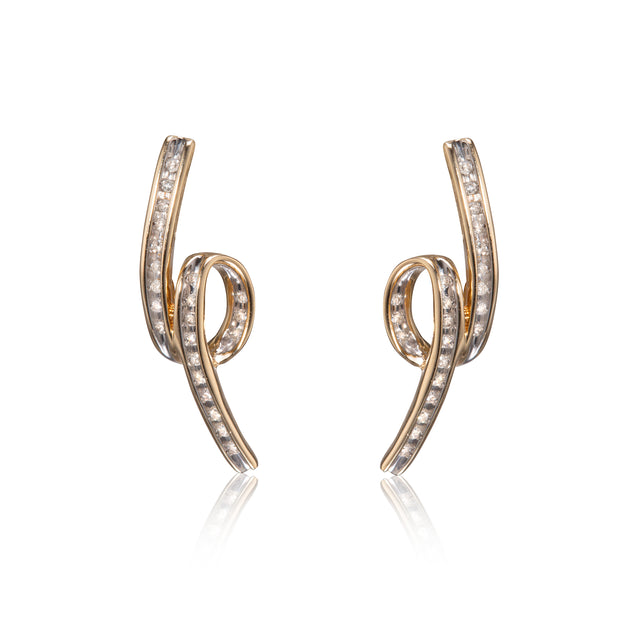 A pair of gold spiral-shaped earrings paved with small clear stones, displayed on a clean white background with a soft reflection below.