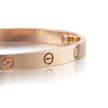 Rose Gold bracelet with three circular screw designs on a white background