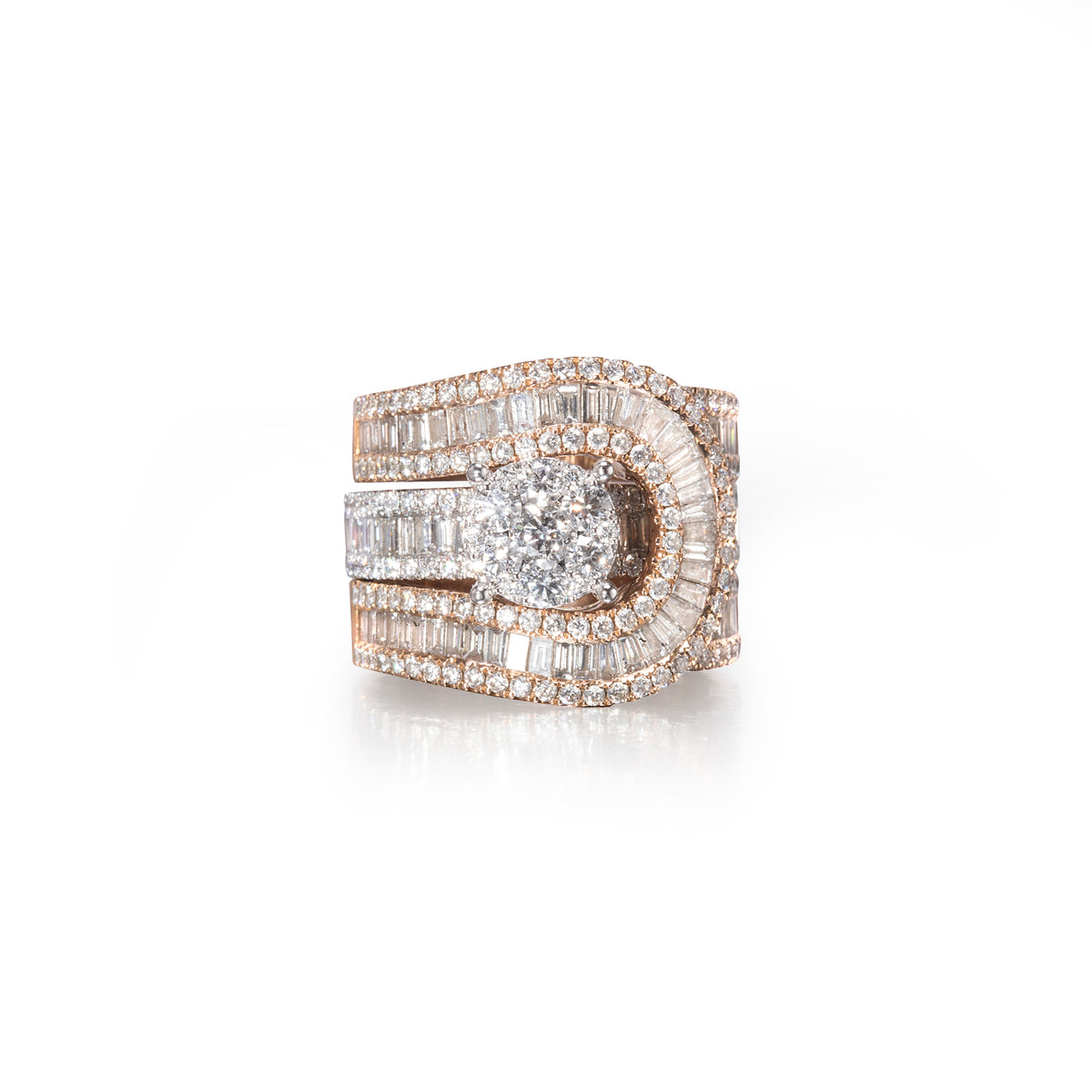 A wide, multi-band ring featuring a central round brilliant-cut diamond surrounded by baguette and round-cut diamonds in a rose gold setting, presented on a clean white background with a soft reflection.