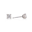 A pair of white gold stud earrings with round-cut clear gemstones, shown from the front and side on a reflective white background.