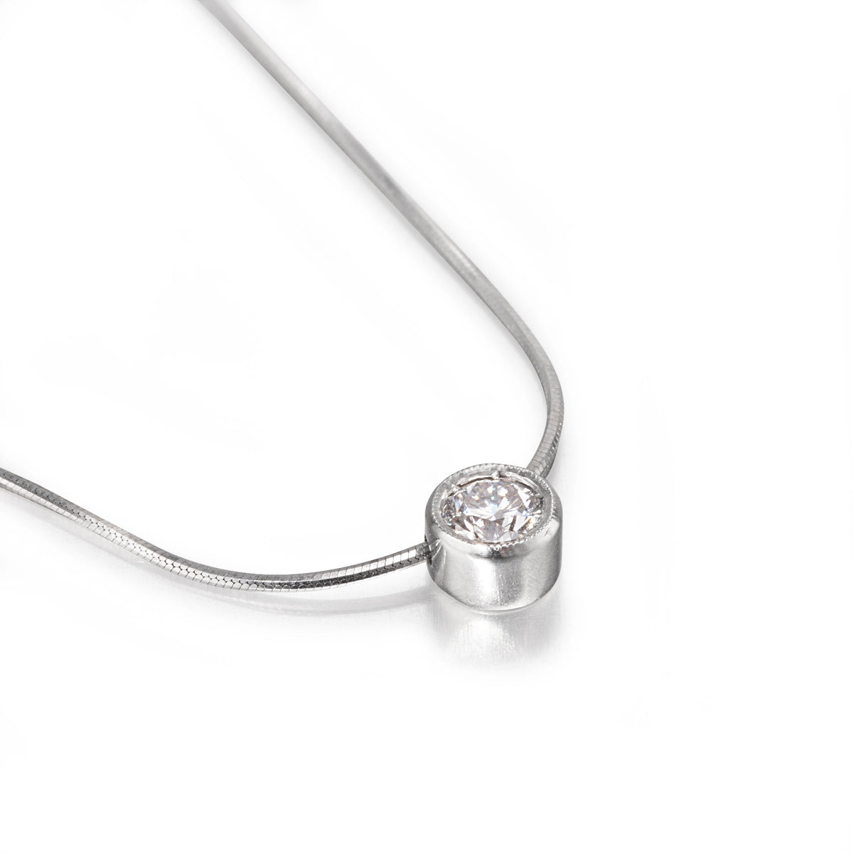 White gold necklace with a round diamond pendant on a white background