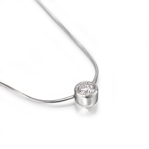 White gold necklace with a round diamond pendant on a white background