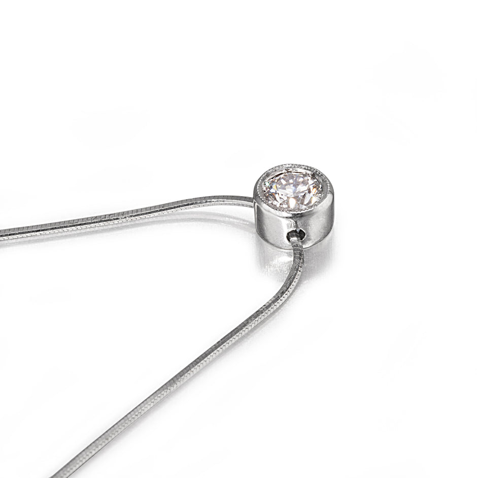 White Gold necklace with a diamond pendant on a white background