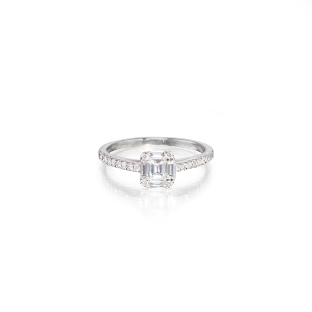 Diamond ring with a emerald-cut center stone on a white background