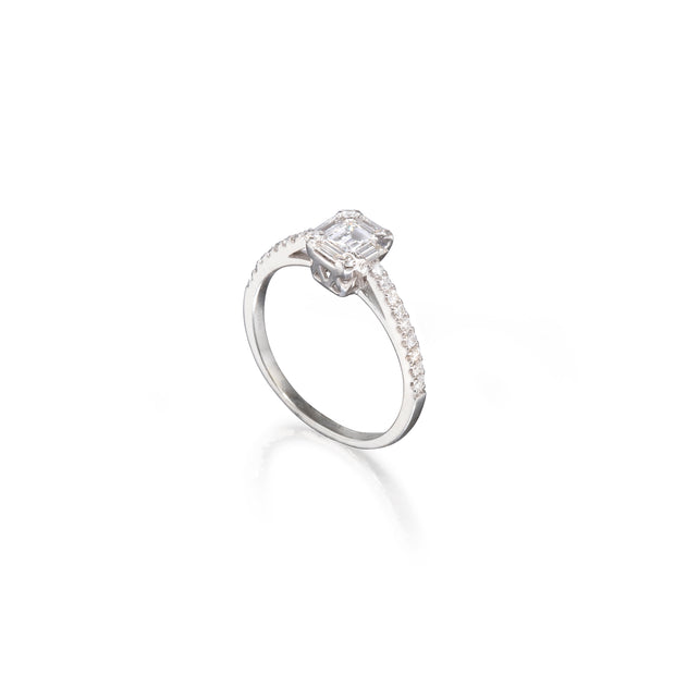 White gold ring with a diamond on a white background