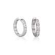 A pair of white gold hoop earrings with a channel setting of clear stones, displayed on a clean white background with a soft reflection below.