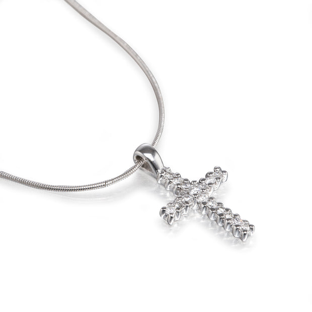 White gold cross pendant necklace on a white background
