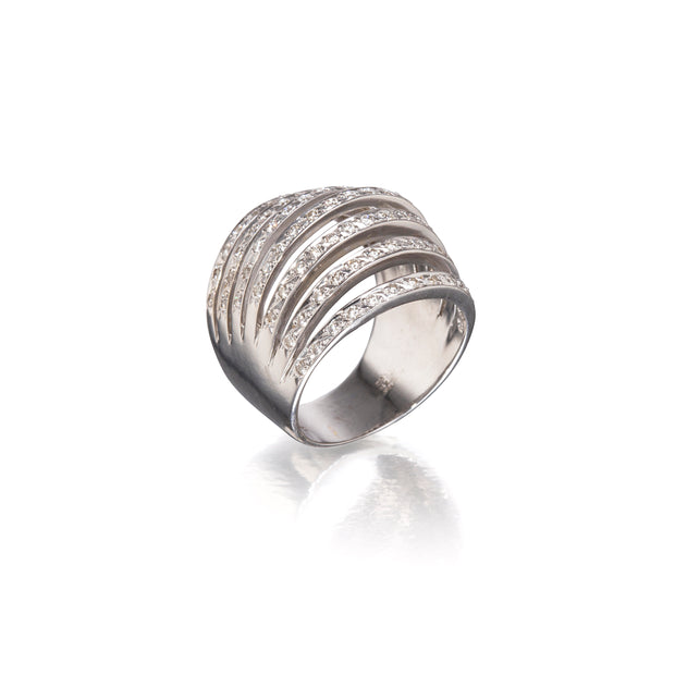 A white gold wrap-around ring with multiple horizontal bands of small clear stones, photographed on a clean white background with a soft reflection below.