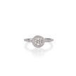 A white gold diamond ring with a round-cut center stone surrounded by a halo of smaller diamonds, set on a slim pavé band, shown on a white background with a soft reflection.