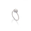 A white gold engagement ring featuring a round-cut center stone surrounded by a halo, with a pavé-set band, shown on a white background with a soft reflection.