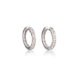 A pair of white gold huggie hoop earrings set with small clear stones, displayed on a clean white background with a soft reflection below.