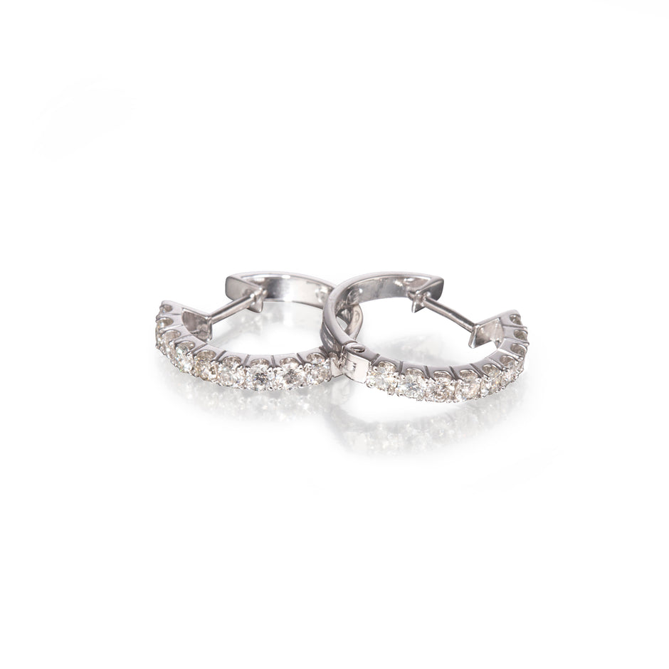 18ct White Gold Diamond Huggie Earrings on a white background