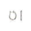 White gold hoop earrings with embedded stones on a white background