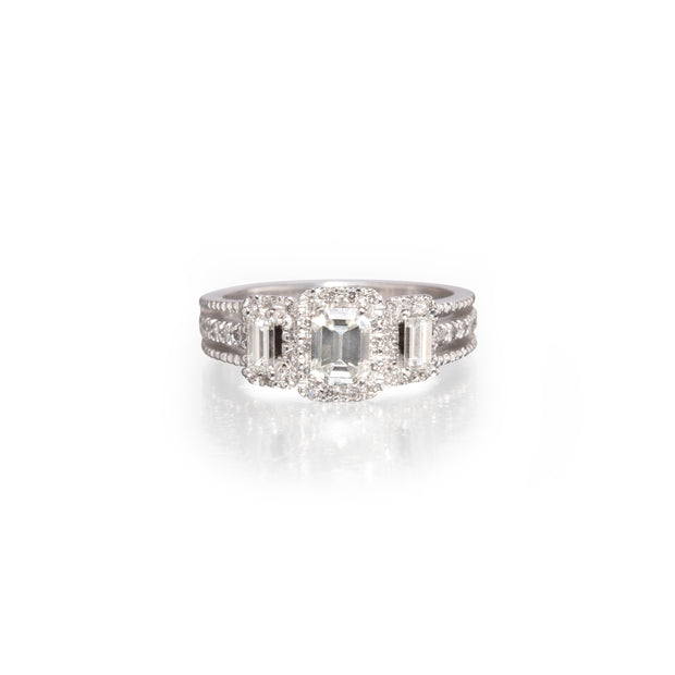 18ct White Gold Emerald Cut Trilogy Diamond Halo Ring on white background