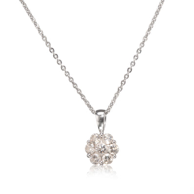 A white gold chain necklace with a round cluster pendant made of clear gemstones in a white gold setting, shown on a white background with a soft reflection below