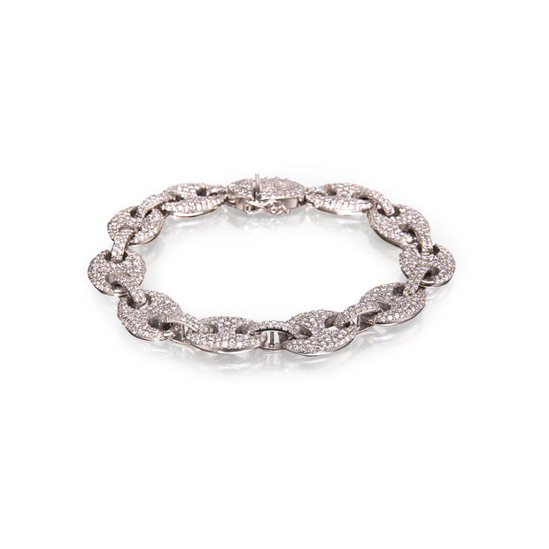 A white gold chain link bracelet paved with small clear stones, displayed on a clean white background.