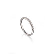 A white gold half-ring band featuring a row of small clear gemstones on one half, displayed on a clean white background with a soft reflection.