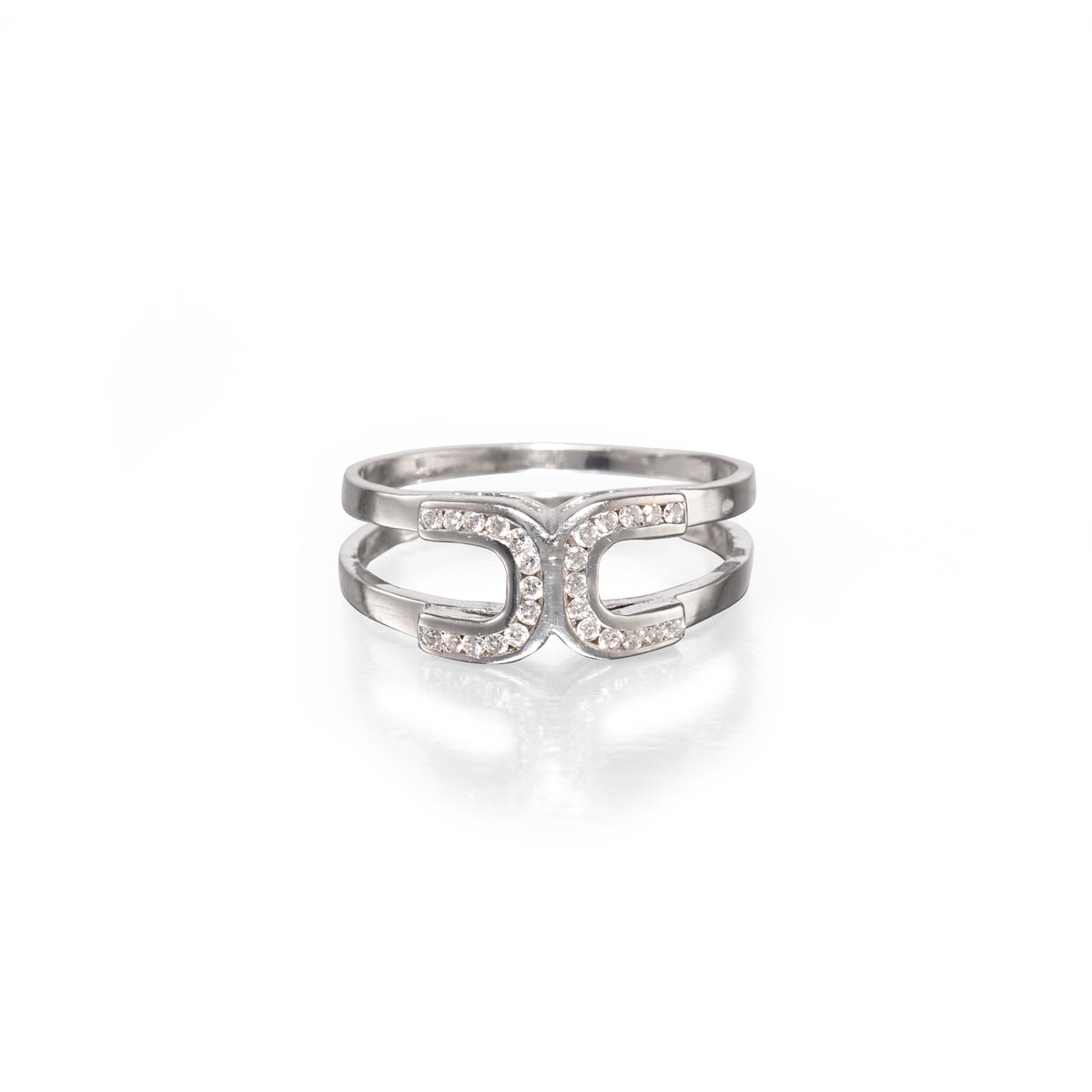 A white gold double horseshoe ring set with small clear stones, shown on a clean white background with a soft reflection below.