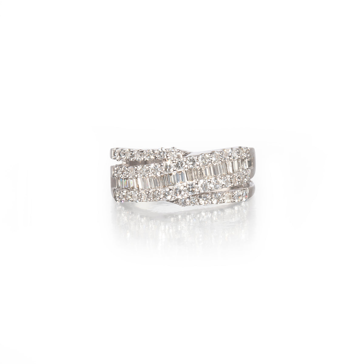 A white gold wrap-around ring with multiple rows of baguette and round-cut clear stones, shown on a clean white background with a soft reflection below.