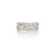A white gold wrap-around ring with multiple rows of baguette and round-cut clear stones, shown on a clean white background with a soft reflection below.