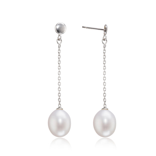 Pearl earrings with silver chains on a white background