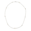 A delicate white gold chain necklace featuring seven white freshwater pearls spaced evenly along the chain, displayed on a clean white background.