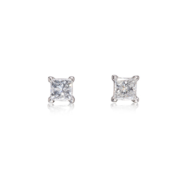 Pair of diamond stud earrings on a white background