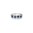 Silver ring with blue gemstones on a white background
