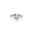 An 18ct white gold solitaire diamond ring with a round brilliant cut diamond set in a simple four-prong setting.