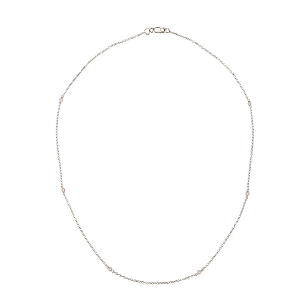 A delicate white gold chain necklace with small spaced bead details and a lobster clasp, displayed on a clean white background.