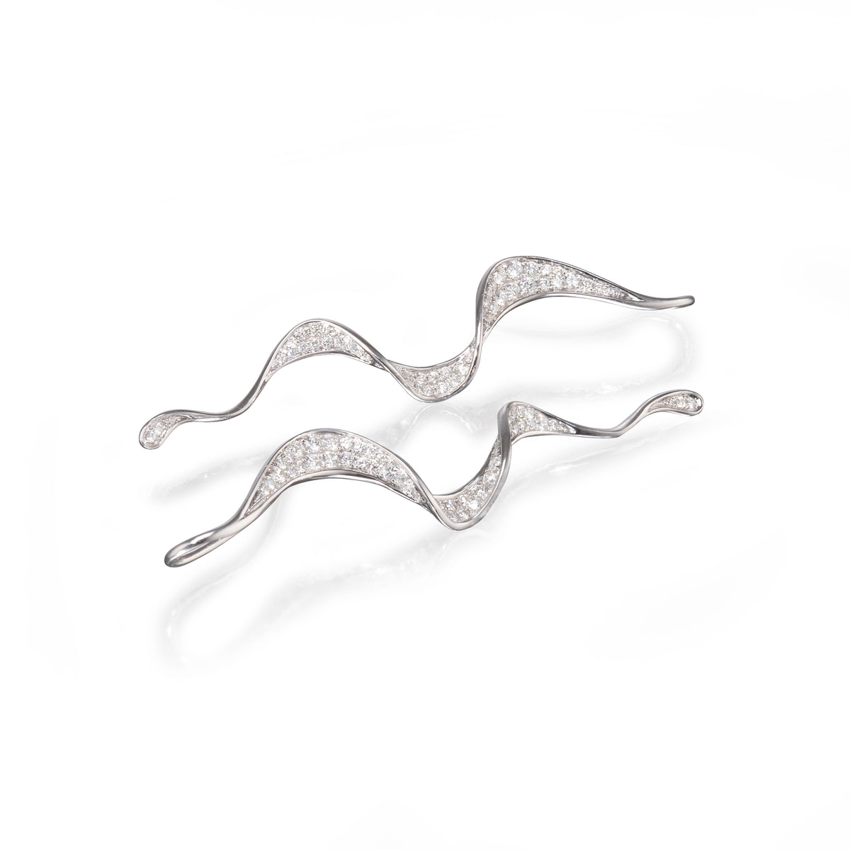 18ct White Gold Twisted Drop Earrings laying down