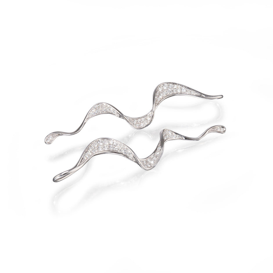 18ct White Gold Twisted Drop Earrings laying down