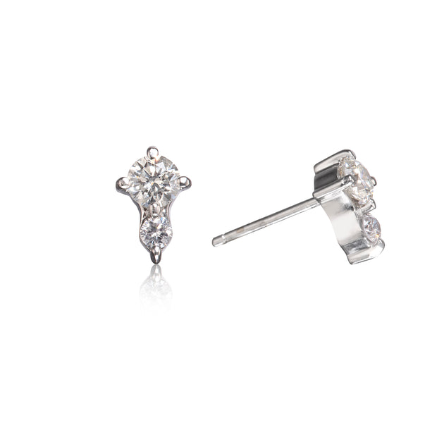 A pair of white gold stud earrings with clear round-cut gemstones, shown from front and side angles on a white background.