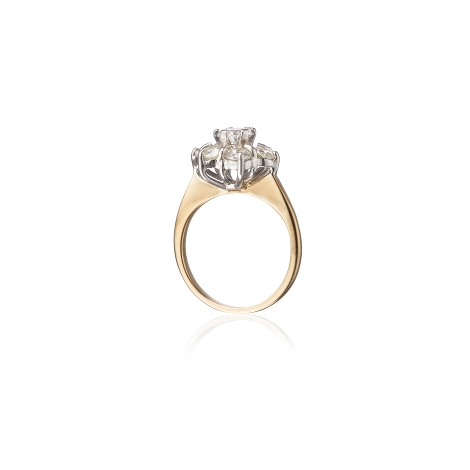 Gold ring with a diamond on a white background