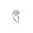Gold ring with a diamond cluster on a white background