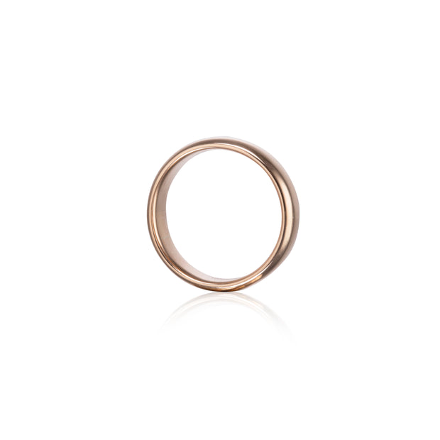 A minimalist rose gold band ring with a smooth, polished finish, shown on a clean white background with a soft reflection underneath.