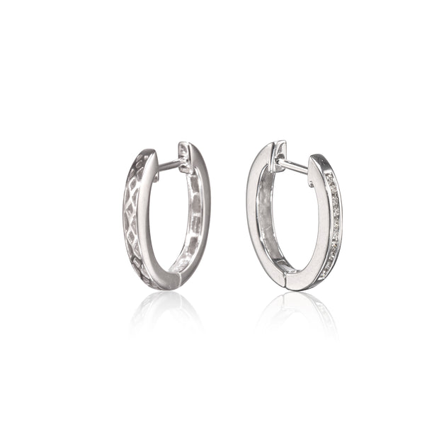 A pair of white gold hoop earrings with textured and pave-set details, displayed on a clean white background with a soft reflection below.