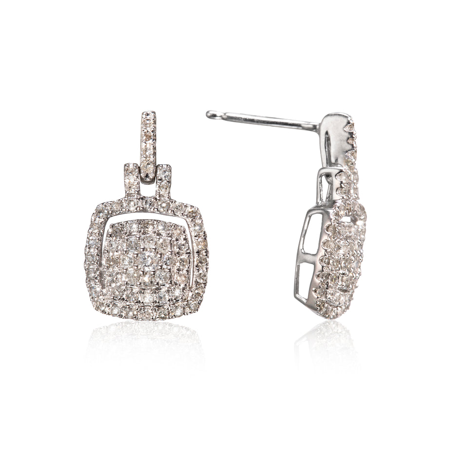 A pair of white gold pavé diamond drop earrings shown from the front and side on a white background with a soft reflection.