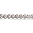 A close-up of a diamond tennis bracelet on a clean white background with a soft reflection below.