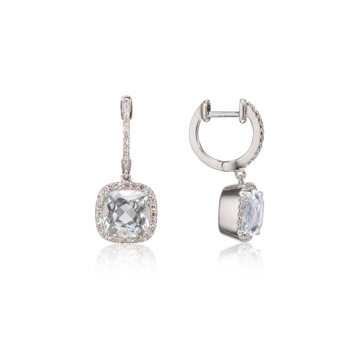 A pair of white gold drop earrings featuring cushion-cut clear gemstones surrounded by small pavé-set stones, shown on a clean white background with one earring facing forward and the other angled to show the side profile.