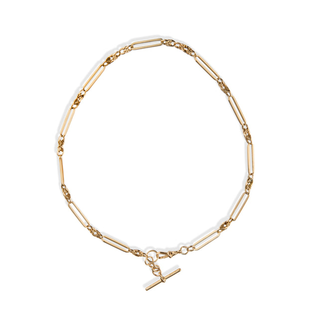 A gold paperclip chain necklace with a toggle clasp, displayed on a clean white background.