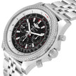 A stainless steel wristwatch with a textured bezel, a black dial with white and red accents, and a matching silver link bracelet, shown on a white background.