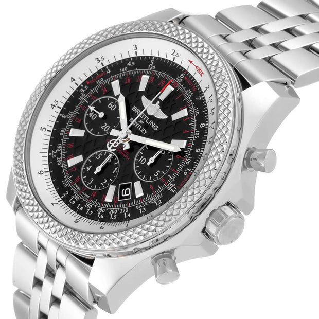 A stainless steel wristwatch with a textured bezel, a black dial with white and red accents, and a matching silver link bracelet, shown on a white background.