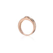 A rose gold ring with a small clear gemstone in a bezel setting, shown on a clean white background with a soft reflection below.