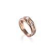 A rose gold ring with a round-cut center stone and a channel-set row of small clear stones, shown on a clean white background.