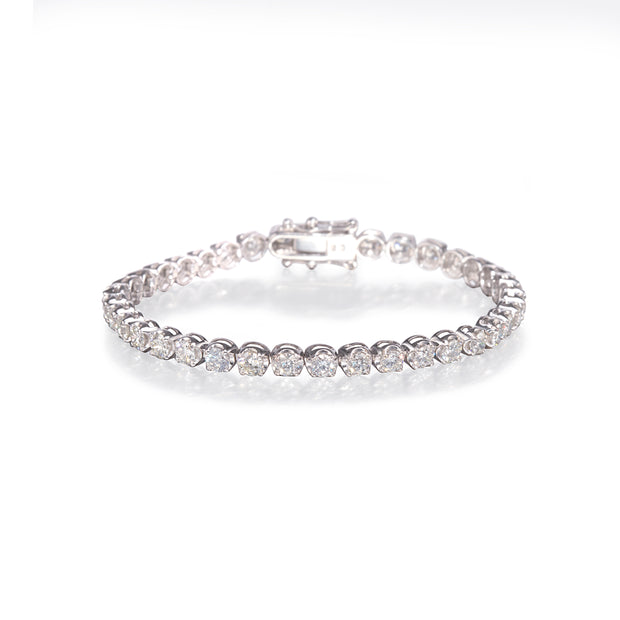 Platinum and rose gold diamond bracelet with clear stones on a white background