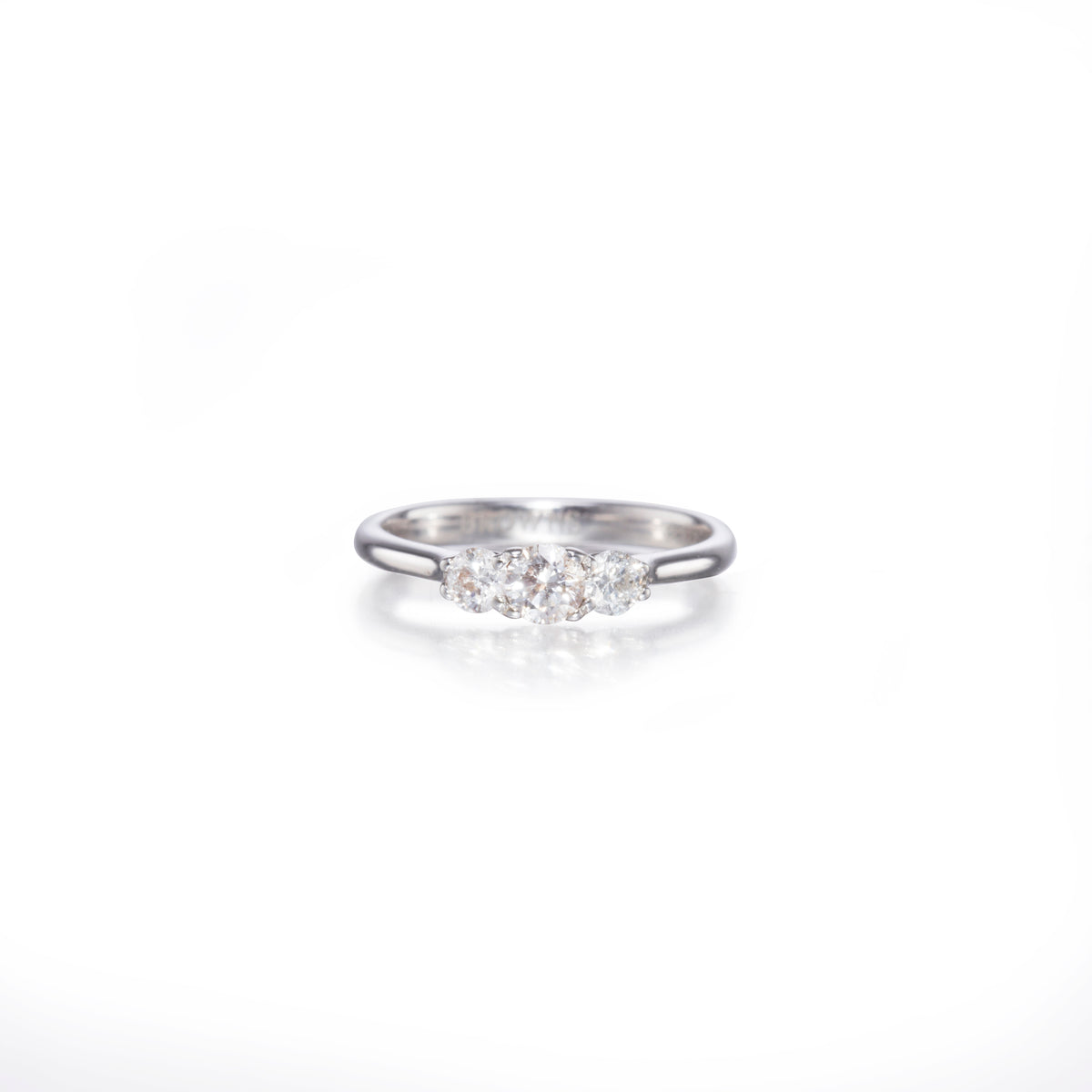 White gold ring with small diamonds on a white background