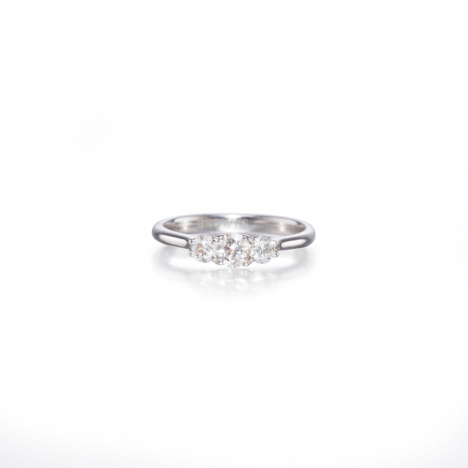 White gold ring with small diamonds on a white background