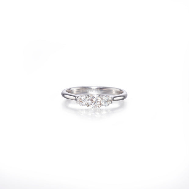 White gold ring with small diamonds on a white background